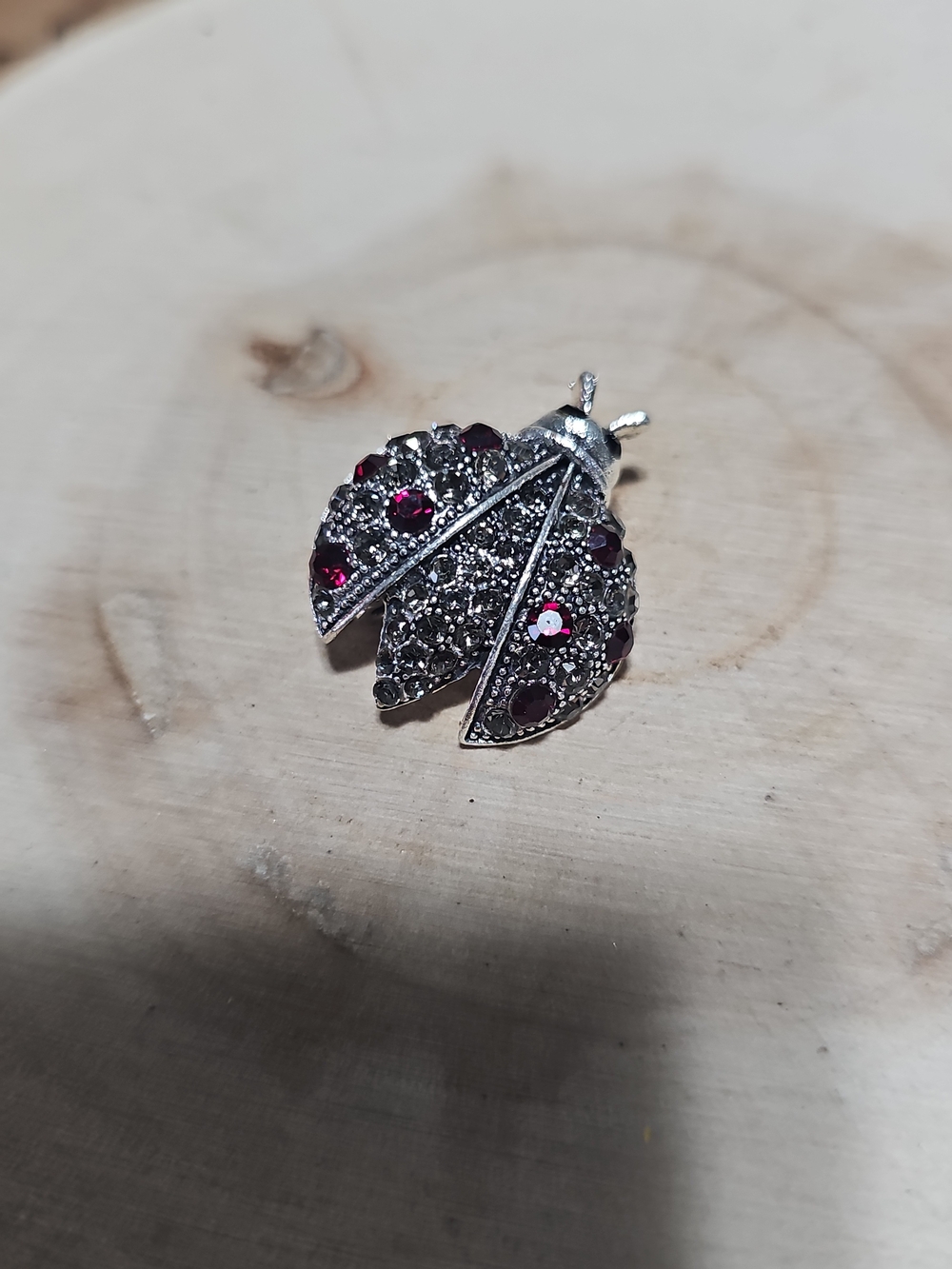 Silver-Tone Ladybug Brooch with Dark Red Crystals